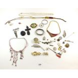 A selection of costume jewellery to include a Victorian black mourning cross etc.