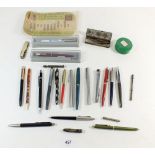 A selection of various fountain pens, ballpoints and some spare nibs