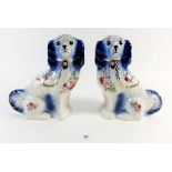 A pair of Staffordshire style dogs printed flowers - 22cm