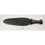 An antique tribal knife with wooden handle and iron leaf form blade, 42cm total length