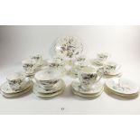 A Coalport tea service "Paradise" comprising: four cups and six saucers, five coffee cans and six
