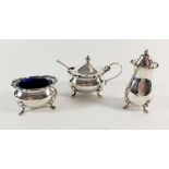 A silver three piece cruet set with blue glass liner, Birmingham 1902