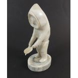 A Greenland Inuit carved bone drummer from Paamiut, 10.5cm