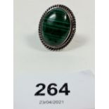 A silver and green malachite ring