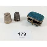 A silver thimble 1898 and a silver plated thimble in purse form holder