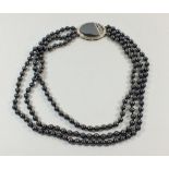 A three strand hematite necklace with sterling silver clasp