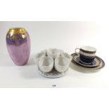 A Bavarian purple lustre vase, a blue and gilt cabinet trio and an egg stand