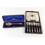 A set of six silver coffee spoons cased and a silver spoon, cased, 82.5g