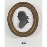 An early 19th century oval watercolour on plaster of a man - 12 x 10cm total size