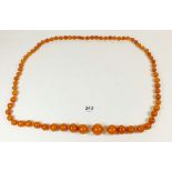 A yellow simulated amber necklace, 88cm 84g