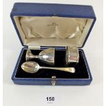 A silver egg cup, napkin ring and spoon - cased, various marks 104g