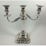 A large silver three branch candleabra with floral and foliate borders, Sheffield 1938 (one sconce