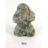 A Candadian Inuit carved green stone group of Mother with child on her back, signed, 11cm from