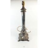 A large silver plated on copper candle lamp converted for electricity, marked to collar 'R. Bests