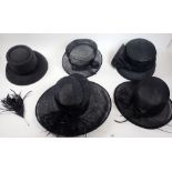 A box of black ladies hats