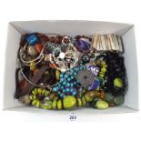 A box of costume jewellery and beads