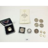 An 1887 Victoria crown, various commemorative crowns, a silver Royal Mint WWII commemorative £2 coin