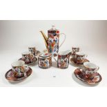 A Japanese coffee set with printed peacock decoration comprising: coffee pot, milk, sugar, six