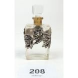 A French glass miniature scent bottle with white metal leaf and berry overlay by "Schiaparelli", "