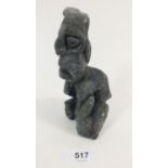 A Greenland Inuit carved black stone grotesque figure from Paamiut, 16cm