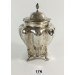A late Victorian silver tea caddy in ribbed baluster shape on four lion paw feet, Chester 1900, 15cm