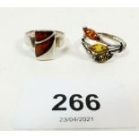 Two silver and amber rings