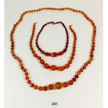 Three various faceted amber coloured necklaces