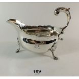 A Georgian silver gravy boat, probably London 1747 by John Pollock, 16cm long - 293g