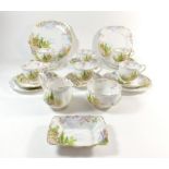 A Royal Albert tea service "Kentish Rockery" comprising: six cups and saucers, four tea plates,