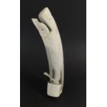 An Inuit carving of Inuit woman and baby, carved from antler bone of Caribou, made in Sisimiut