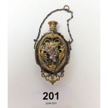 A 19th century French gilt and white metal cased pendant scent bottle decorated flowers and
