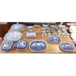 A large selection of blue and white china including a set of three Copeland Spode meat plates, ten