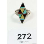 A Native American design silver and hardstone ring, sunburst mark to rear, size Q