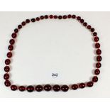 A red cherry amber Bakelite necklace, 103.5g