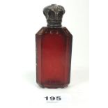A Victorian red glass scent bottle with silver plated lid