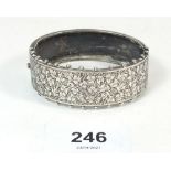 A Victorian silver bangle with engraved decoration