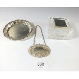 A silver pin dish, 60g, silver whisky decanter label, 14g and a cut glass box with silver lid
