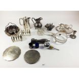 A box of silver plated items to include jugs, toast racks etc