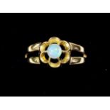 An 18 carat gold opal flower form ring, size M/N, 3.2g