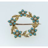 A Victorian 15 carat gold turquoise and pearl circular brooch of floral design, 2.8cm diameter, 4.8g