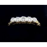 A 14 carat gold ring circa 1920's illusion set five diamonds, size P