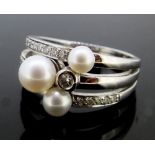 An 18 carat white gold "Rain Dance" style ring set diamonds and pearls, size R/S, 10g