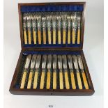 A late 19thC silver plated fish knives and forks cutlery set with bone handles (one knife missing)