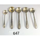 A set of four silver salt spoons, London 1866 with one other, 26g