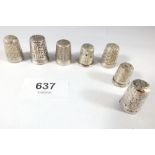 A group of seven silver thimbles