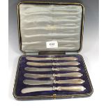 A set of silver tea knives