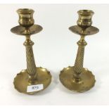 A pair of brass spiral turned candle sticks - 16cm