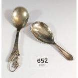 A Danish silver Art Nouveau caddy spoon and a silver plated example