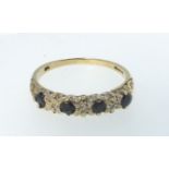 A 9ct gold ring set four sapphires and diamond chips, 1.9g, size P