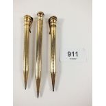 Three gold plated pencils